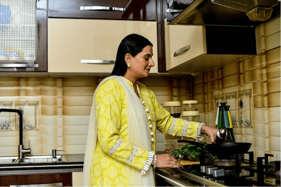 Women easily cooking frozen Malabar paratha