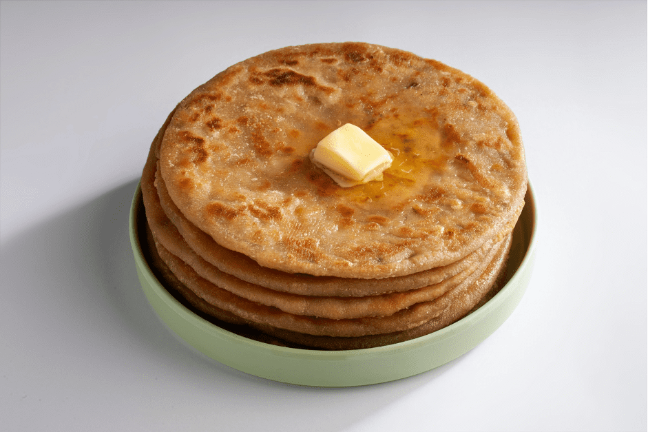 Goeld aloo paratha in white Background