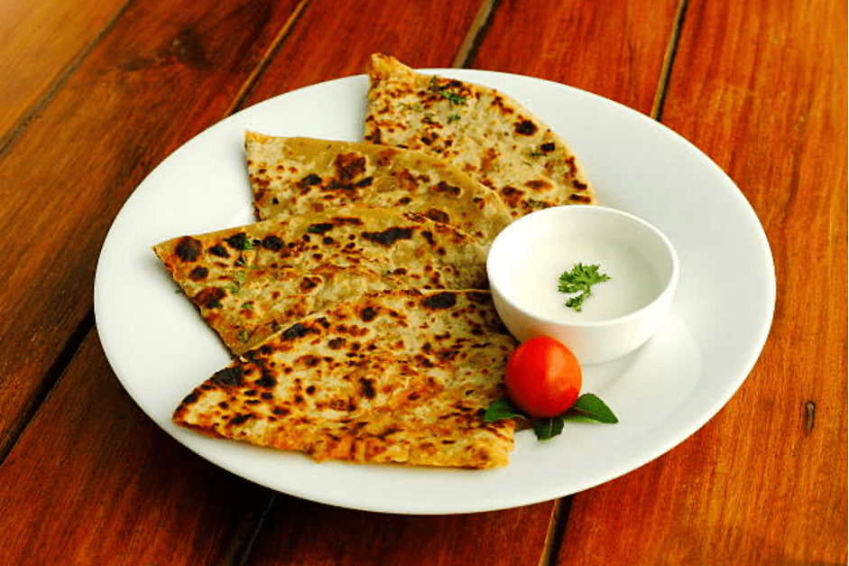 Aloo Paratha serving with curd